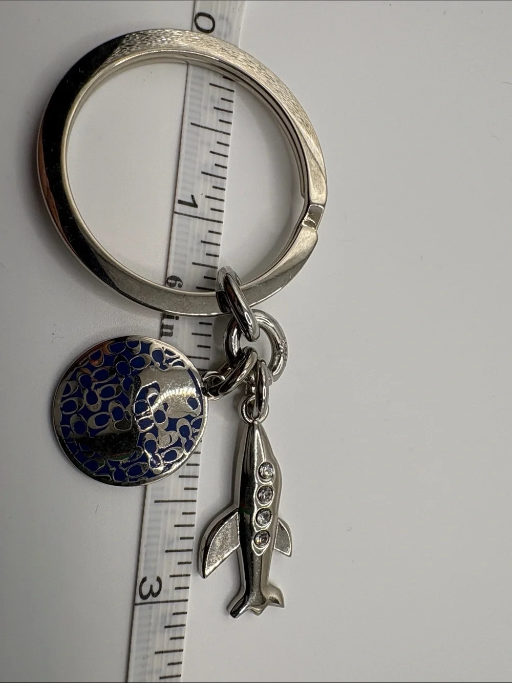 Coach Silver Airplane Keychain with Navy Enamel Glob Charm